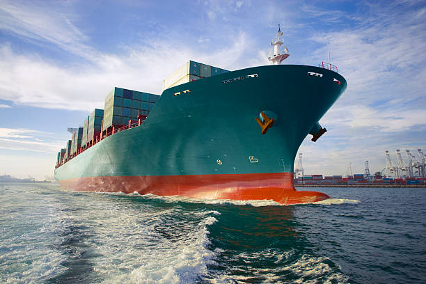 Ocean container freighter ship sailing open waters